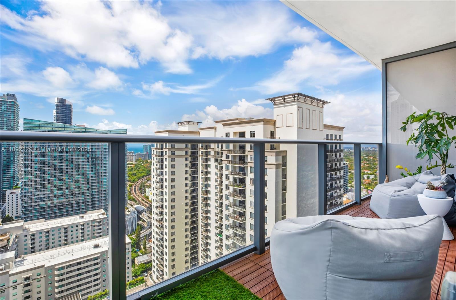 55 Southwest 9th Street, Unit 3205 Miami, FL 33130 - Photo 20 of 39 a view of a balcony with city view
