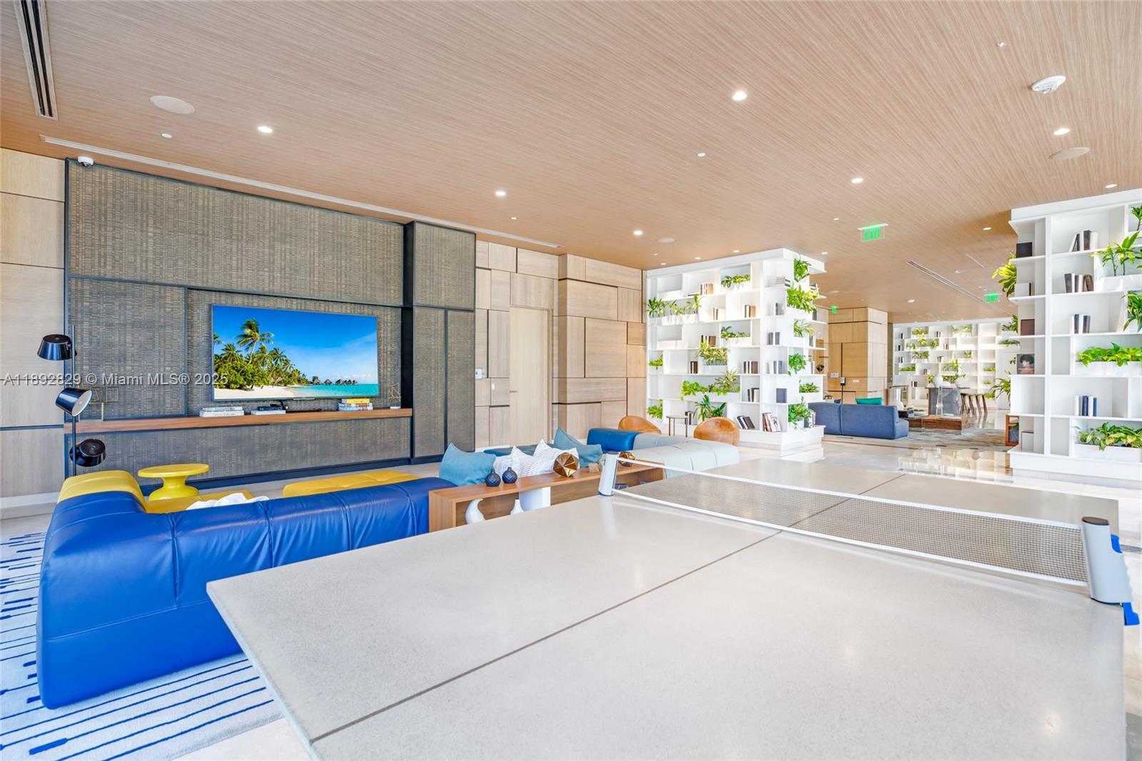 55 Southwest 9th Street, Unit 3205 Miami, FL 33130 - Photo 23 of 39 a living room with stainless steel appliances kitchen island granite countertop furniture and a flat screen tv
