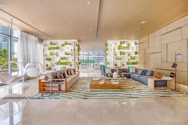 a living room with furniture pool and outdoor seating