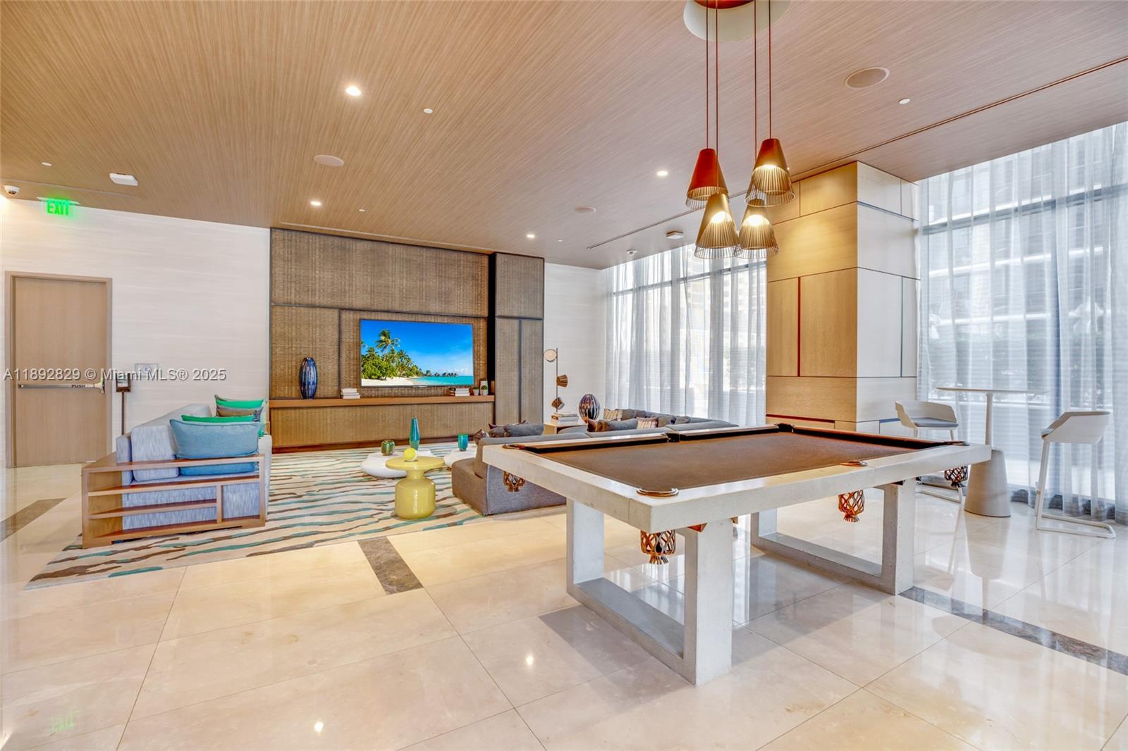 55 Southwest 9th Street, Unit 3205 Miami, FL 33130 - Photo 30 of 39 a room with pool table and glass windows