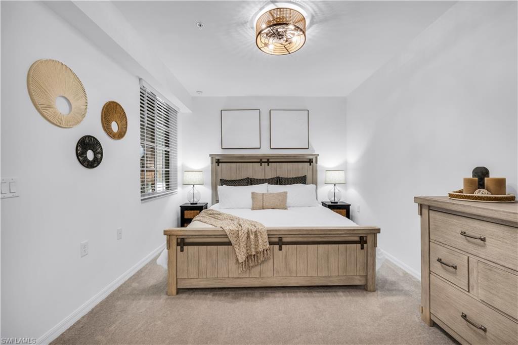 43989 Boardwalk Loop, Unit 2032 Punta Gorda, FL 33982 - Photo 11 of 14 a bedroom with a bed and a window