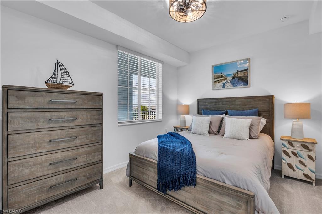 43989 Boardwalk Loop, Unit 2032 Punta Gorda, FL 33982 - Photo 13 of 14 a bedroom with a bed and a window