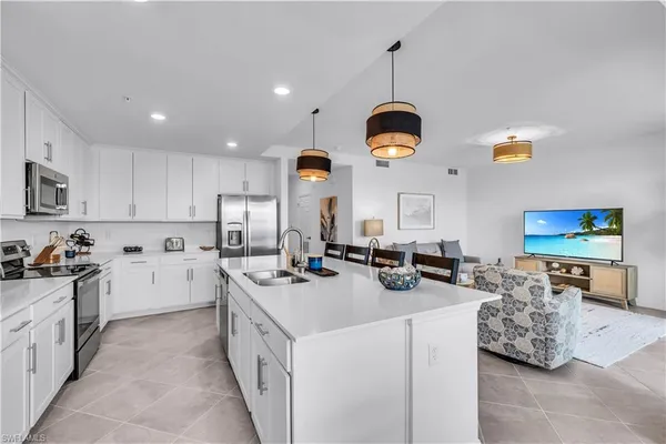 a kitchen with stove and cabinets