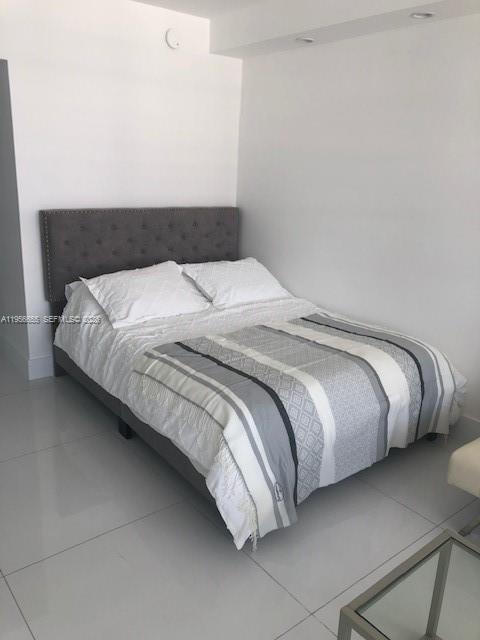 100 Lincoln Road, Unit 1112 Miami Beach, FL 33139 - Photo 11 of 48 a bedroom with a bed and window