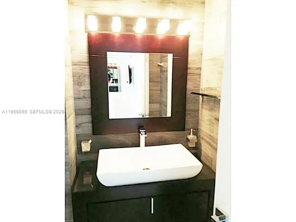 a bathroom with a shower and toilet