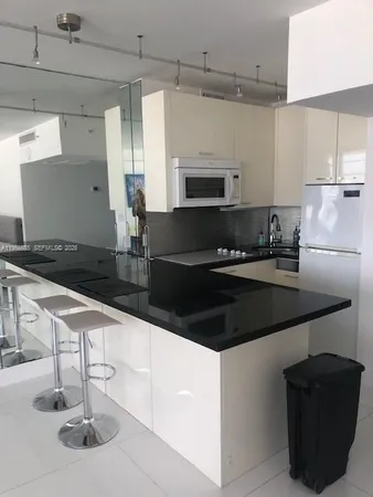 a kitchen with a sink and a stove