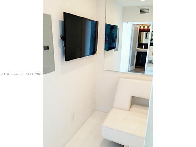 100 Lincoln Road, Unit 1112 Miami Beach, FL 33139 - Photo 20 of 48 a bathroom with a sink and mirror