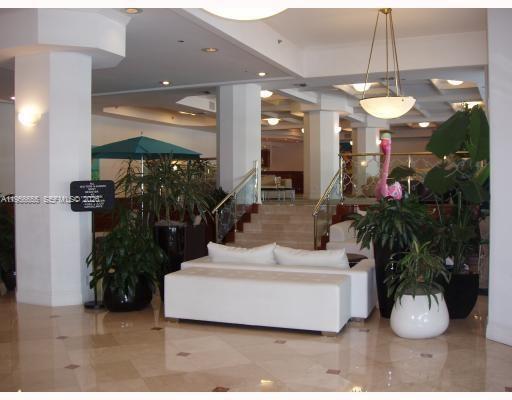 100 Lincoln Road, Unit 1112 Miami Beach, FL 33139 - Photo 28 of 48 a living room with furniture and a chandelier