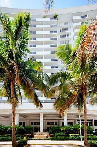 100 Lincoln Road, Unit 1112 Miami Beach, FL 33139 - Photo 36 of 48 a front view of multiple houses with a yard