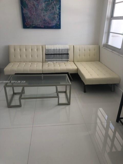 100 Lincoln Road, Unit 1112 Miami Beach, FL 33139 - Photo 4 of 48 a living room with furniture and a couch