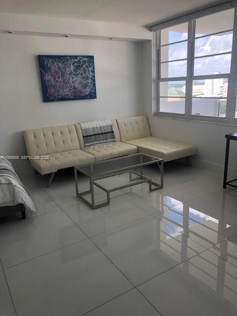 100 Lincoln Road, Unit 1112 Miami Beach, FL 33139 - Photo 5 of 48 a living room with furniture and a window