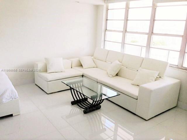 100 Lincoln Road, Unit 1112 Miami Beach, FL 33139 - Photo 6 of 48 a living room with furniture and a window