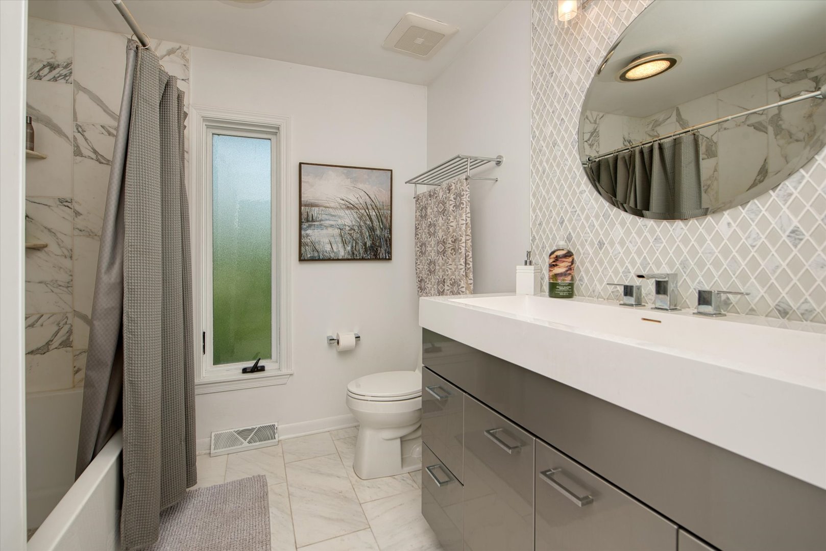 1196 Nottingham Lane Elgin, IL 60120 - Photo 37 of 45 a bathroom with a sink toilet a mirror and shower