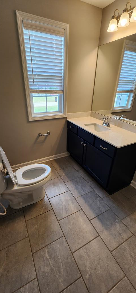 486 Abberly Lane Ellerslie, GA 31807 - Photo 30 of 67 a bathroom with a sink a toilet and mirror
