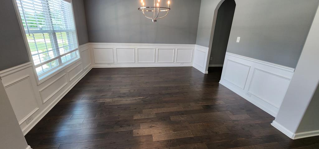 486 Abberly Lane Ellerslie, GA 31807 - Photo 3 of 67 a view of an empty room with wooden floor and a window