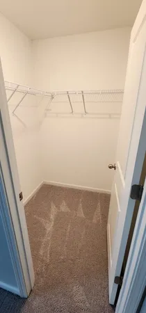 a bathroom with a glass door shower and toilet