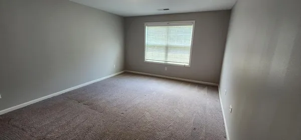 a view of a yard with a swimming pool