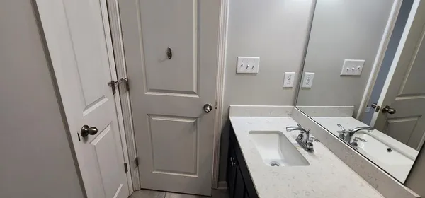 a view of a livingroom with wooden floor and window