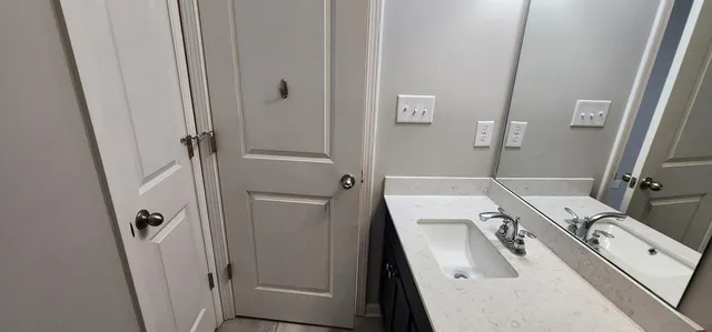 a view of a livingroom with wooden floor and window
