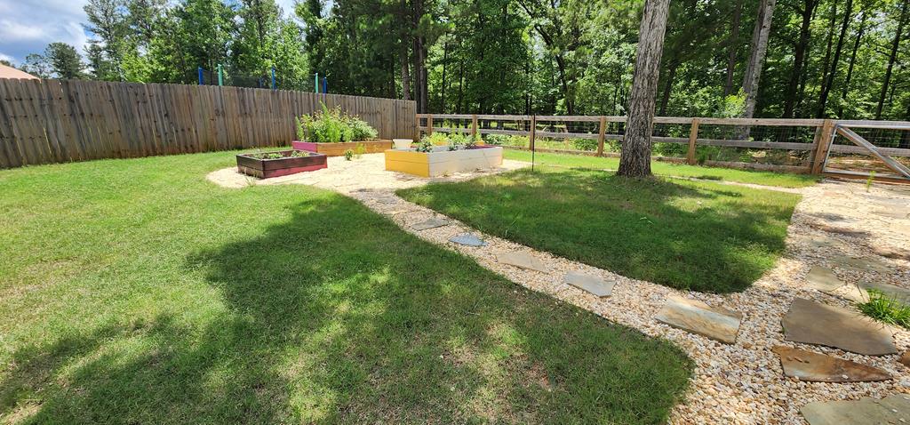 486 Abberly Lane Ellerslie, GA 31807 - Photo 58 of 67 a view of a small yard with a small pool and sitting area