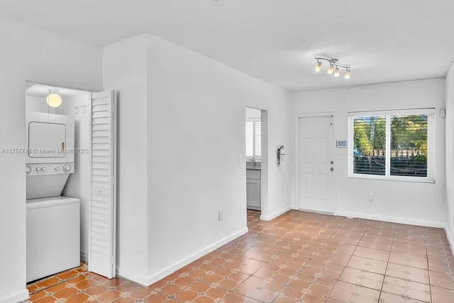 a view of an empty room and window