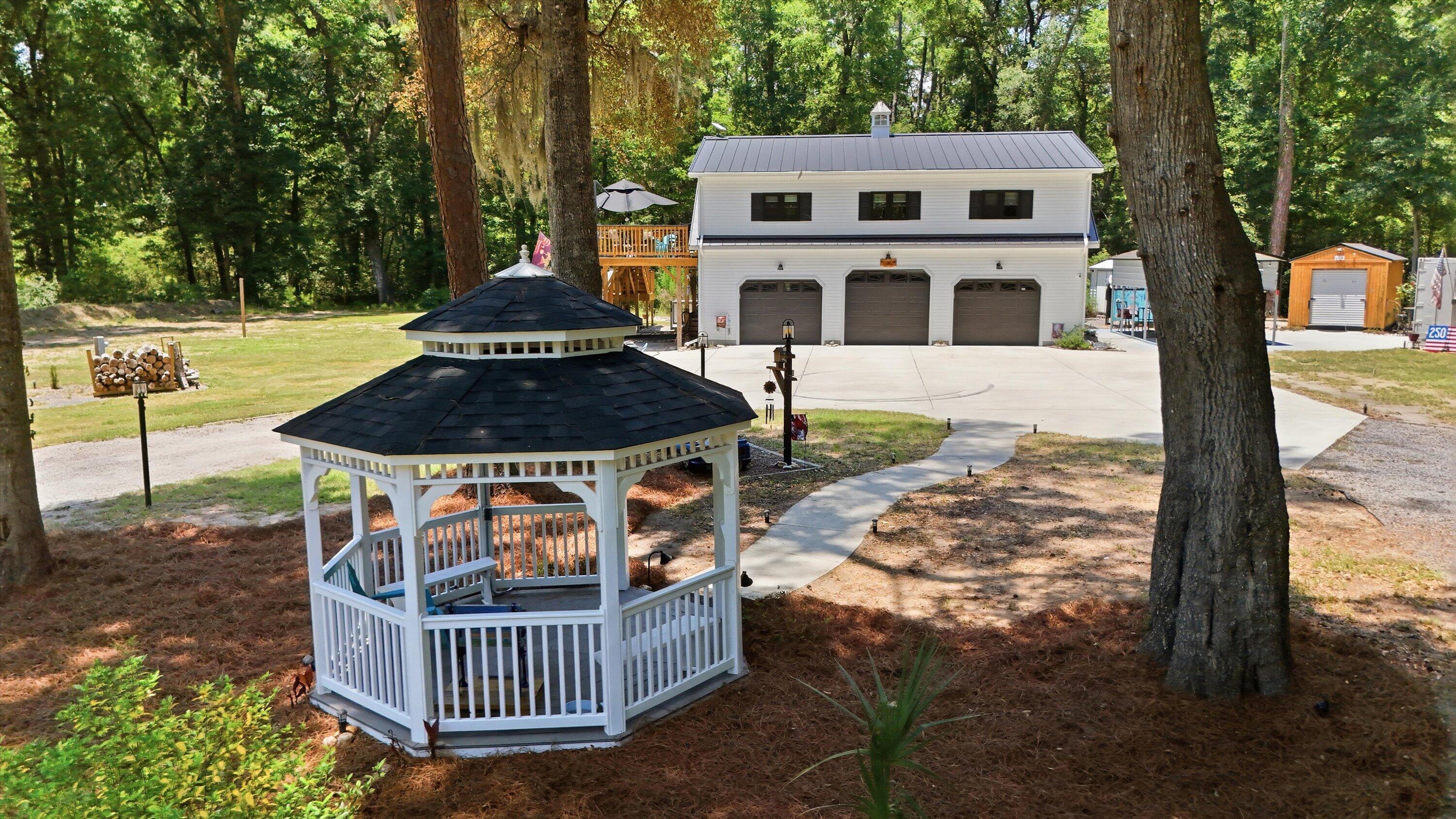 8246 Oyster Factory Road Edisto Island, SC 29438 - Photo 3 of 66 01-015_DJI_20260707133246_0044_D_1