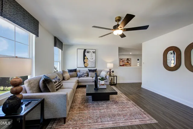 a living room with furniture and a rug