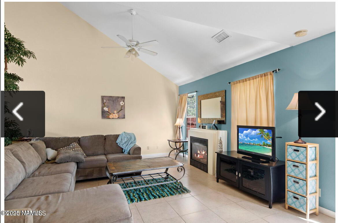 4011 East Village Circle Flagstaff, AZ 86004 - Photo 11 of 23 a living room with furniture and a flat screen tv