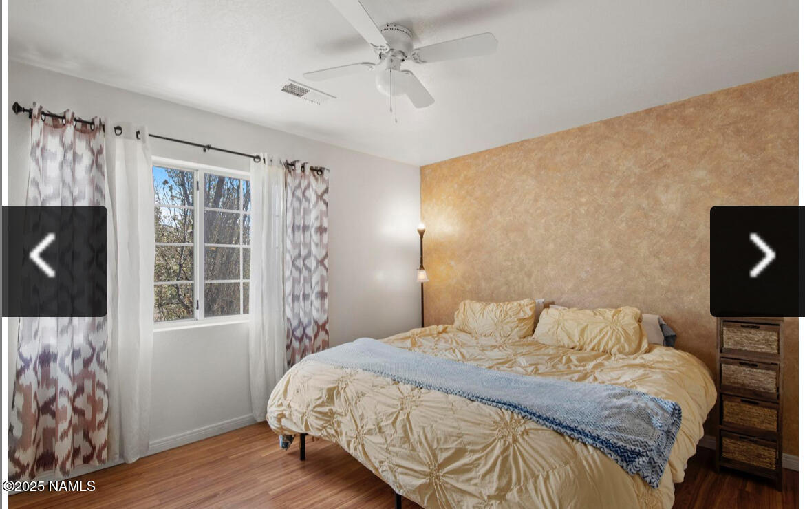 4011 East Village Circle Flagstaff, AZ 86004 - Photo 15 of 23 a bedroom with a bed and a window