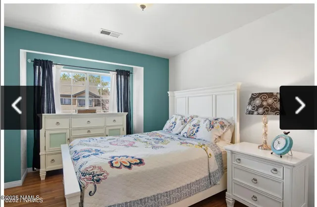 a bedroom with furniture and a window