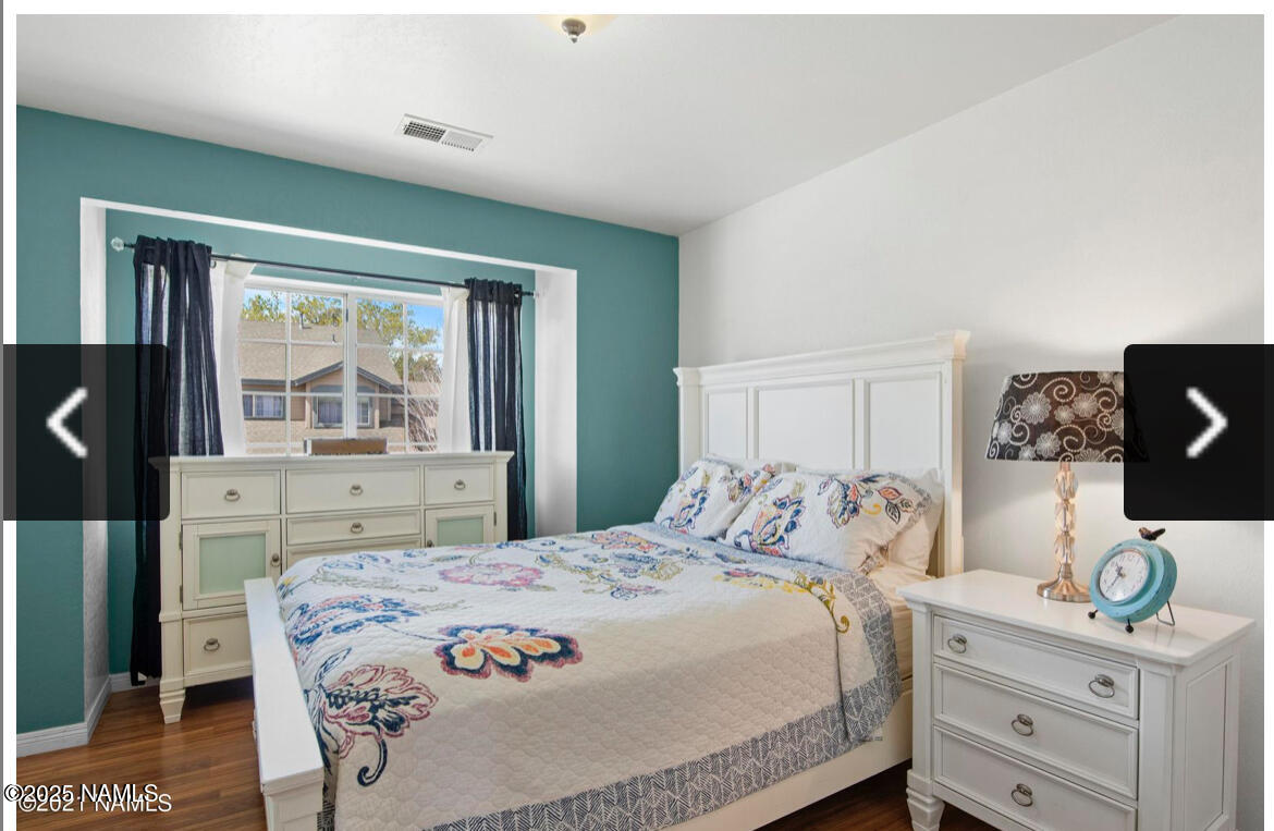 4011 East Village Circle Flagstaff, AZ 86004 - Photo 18 of 23 a bedroom with a bed and a window