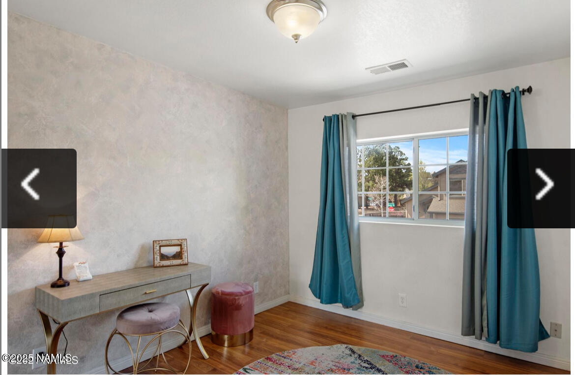 4011 East Village Circle Flagstaff, AZ 86004 - Photo 19 of 23 a bedroom with furniture and a window