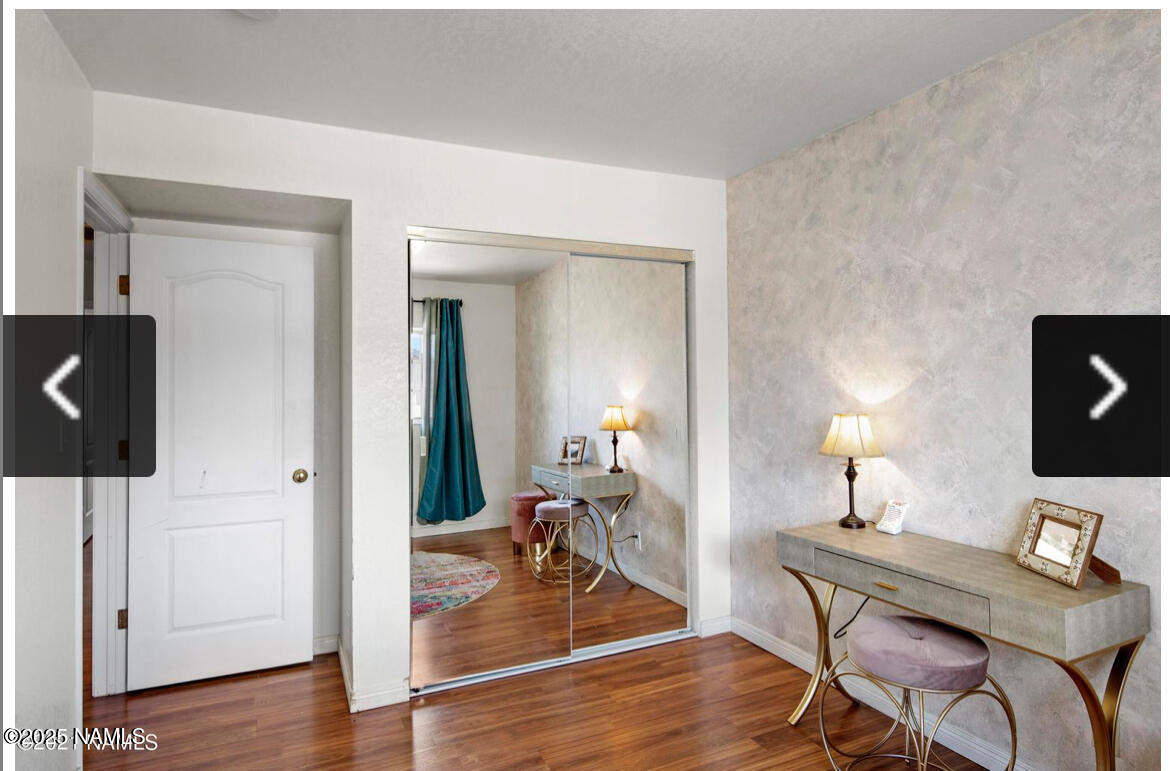 4011 East Village Circle Flagstaff, AZ 86004 - Photo 20 of 23 a workspace with furniture and wooden floor