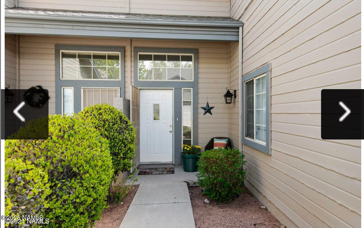 4011 East Village Circle Flagstaff, AZ 86004 - Photo 2 of 23 a view of a pathway besides a house
