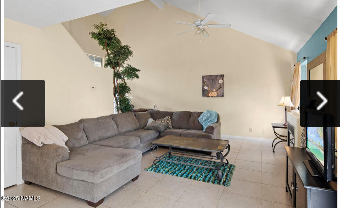 4011 East Village Circle Flagstaff, AZ 86004 - Photo 8 of 23 a living room with furniture and a potted plant