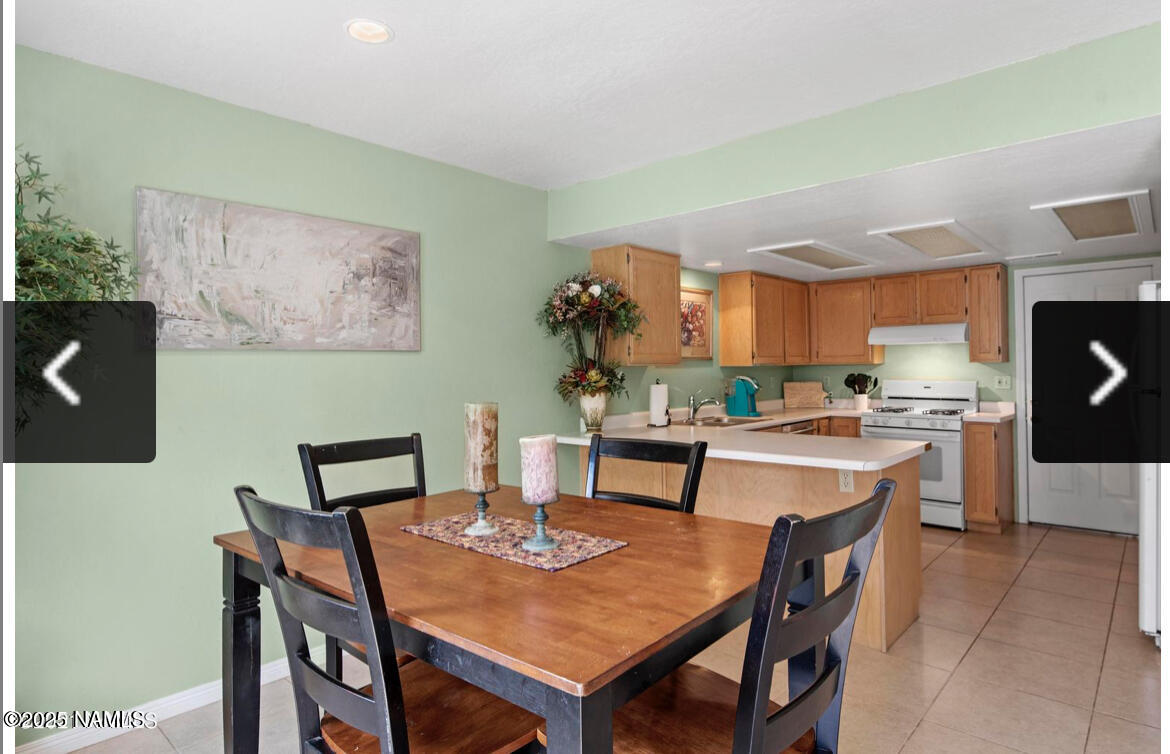 4011 East Village Circle Flagstaff, AZ 86004 - Photo 9 of 23 a view of a dining room with furniture