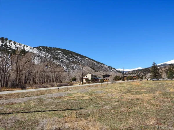 a view of a building with a snow on the road