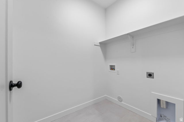 1869 South 2425 West Ogden, UT 84401 - Photo 18 of 22 Laundry area featuring washer hookup, hookup for an electric dryer, and light tile patterned flooring