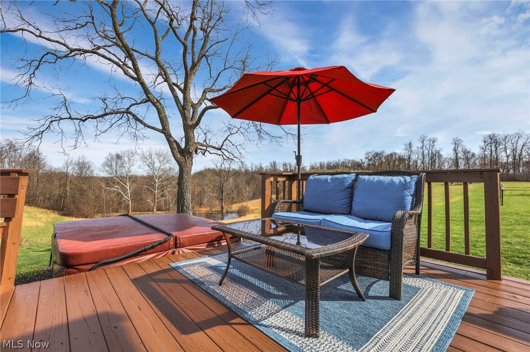 5502 Dutch Ridge Road New Straitsville, OH 43766 - Photo 46 of 49 Deck featuring a hot tub and a yard