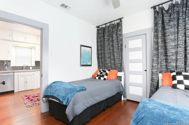 a bedroom with a bed and window