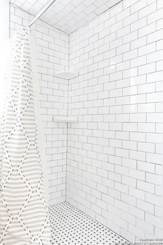 a bathroom with a white toilet