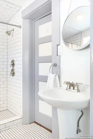 a bathroom with a sink and a mirror