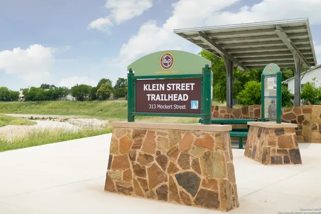 a view of swimming pool with an outdoor seating and a yard