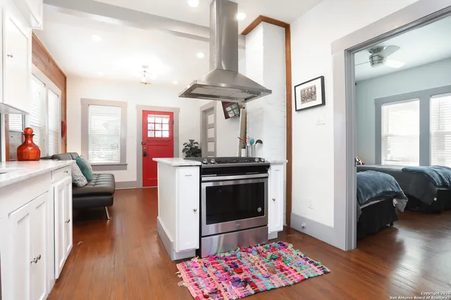 a kitchen with stainless steel appliances granite countertop a stove and a sink
