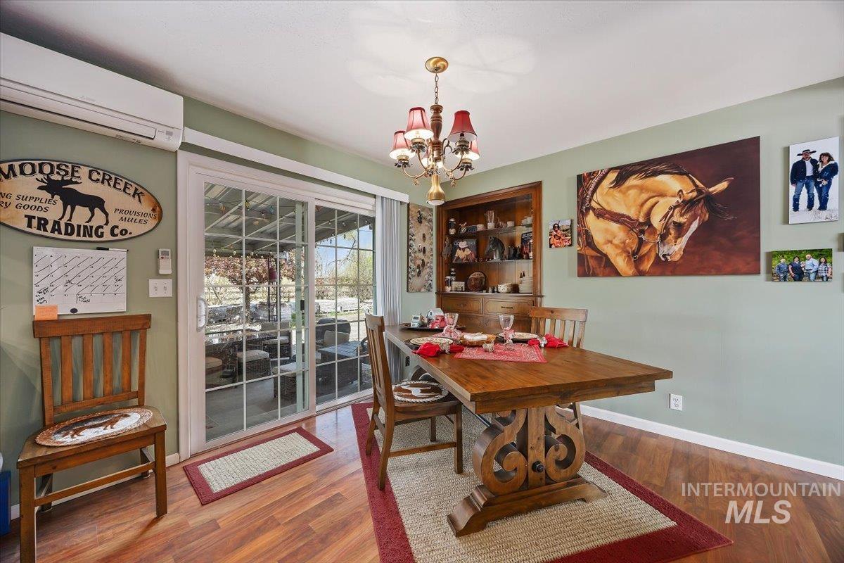 1301 A Street Rupert, ID 83350 - Photo 11 of 45 Dining room featuring a chandelier and wood finished floors