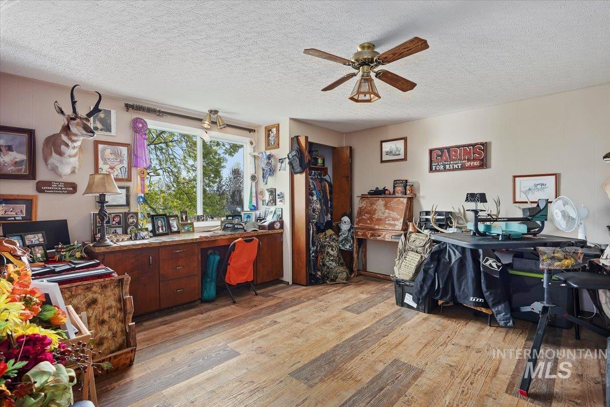 1301 A Street Rupert, ID 83350 - Photo 27 of 45 Office featuring light wood-style floors, a textured ceiling, and a ceiling fan