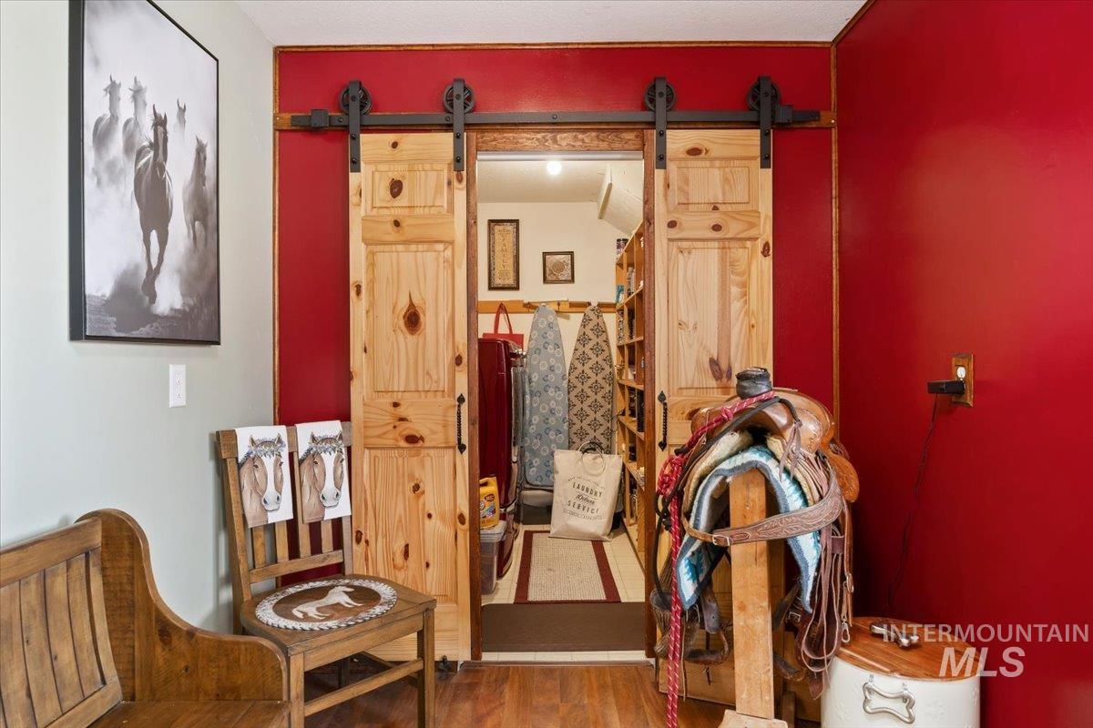 1301 A Street Rupert, ID 83350 - Photo 29 of 45 Sitting room featuring a barn door and wood finished floors