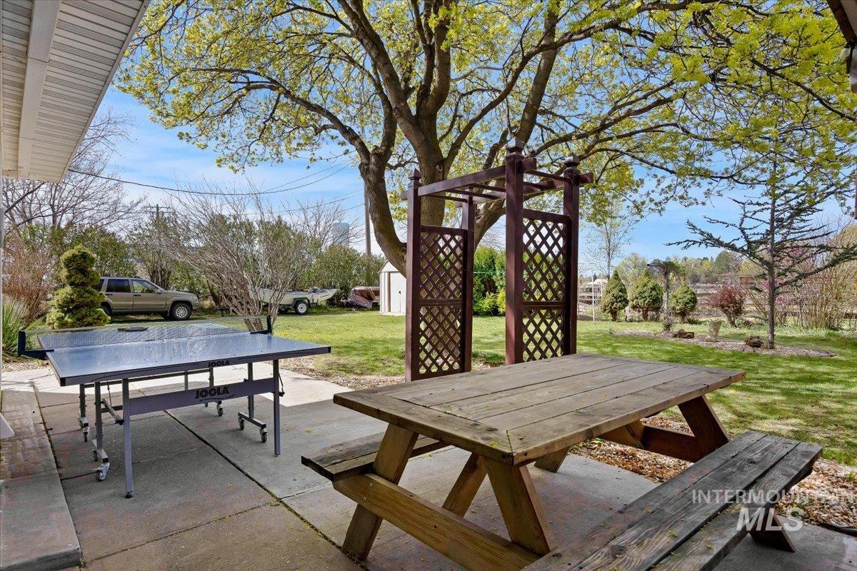 1301 A Street Rupert, ID 83350 - Photo 31 of 45 View of patio / terrace with outdoor dining space and a storage unit
