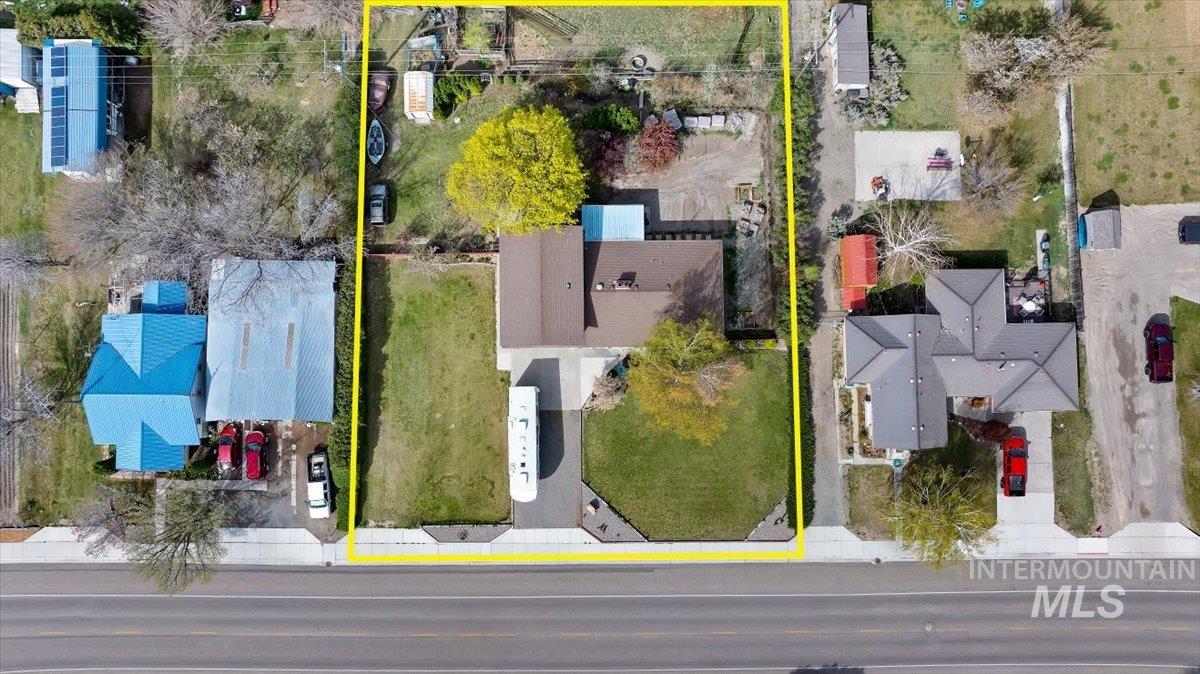 1301 A Street Rupert, ID 83350 - Photo 36 of 45 Aerial perspective of suburban area with property parcel outlined