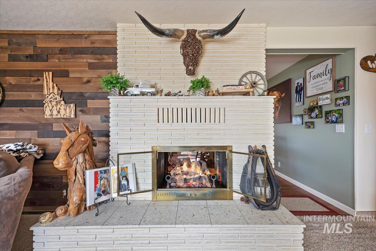 1301 A Street Rupert, ID 83350 - Photo 8 of 45 Detailed view of a fireplace and carpet floors